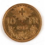 A Swiss 1915 10 francs gold coin.