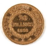 An 1898 French 20 francs gold coin.