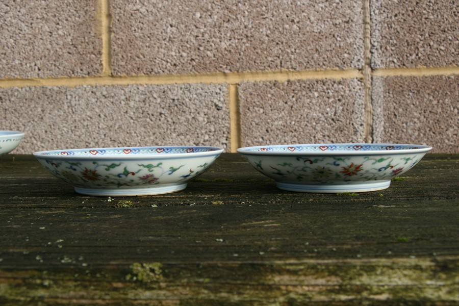 A pair of Chinese shallow dishes decorated with foliate scrolls, blue seal mark to the underside, - Image 9 of 13