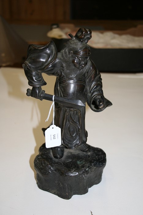 A Japanese bronze figure in the form of a warrior holding a sword, on a rocky base, 33cms (13ins) - Image 2 of 4