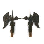 A pair of iron halberd heads decorated with dragons (possibly French), 23cms (9ins) long (2).