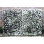A pair of composite stone wall plaques depicting classical busts, 39cms (15.5ins) wide.