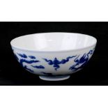 A 19th century Chinese blue & white bowl decorated with dragons amongst clouds, Qianlong seal mark