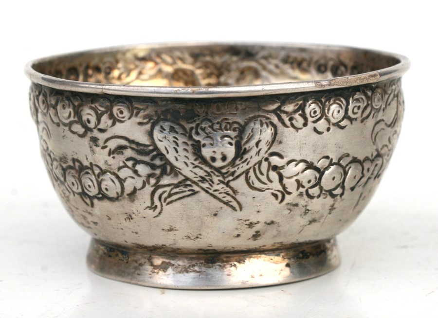 A late 18th / early 19th century silver footed bowl embossed with angels and swag decoration (