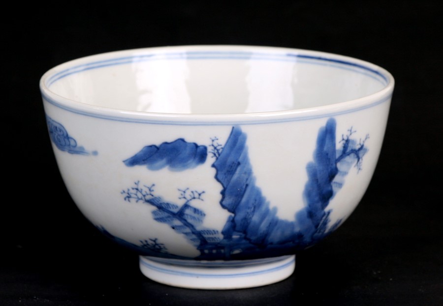 A Chinese blue & white bowl decorated with figures in a landscape, 14cms (5.5ins) diameter.Condition