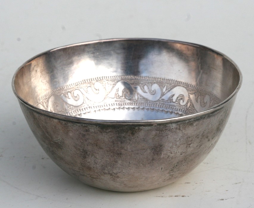 A Persian silver coloured metal bowl, the internal rim decorated with calligraphy, weight 115g,