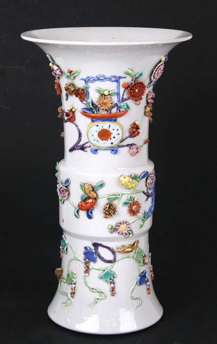 A large 18th / 19th century Chinese Gu vase with applied decoration depicting precious objects,