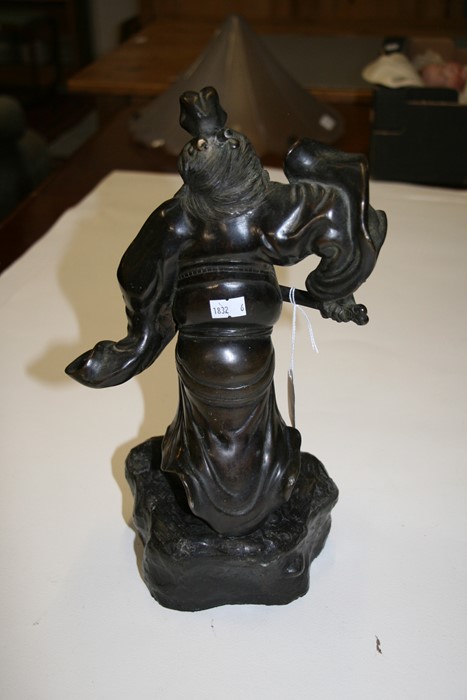 A Japanese bronze figure in the form of a warrior holding a sword, on a rocky base, 33cms (13ins) - Image 3 of 4