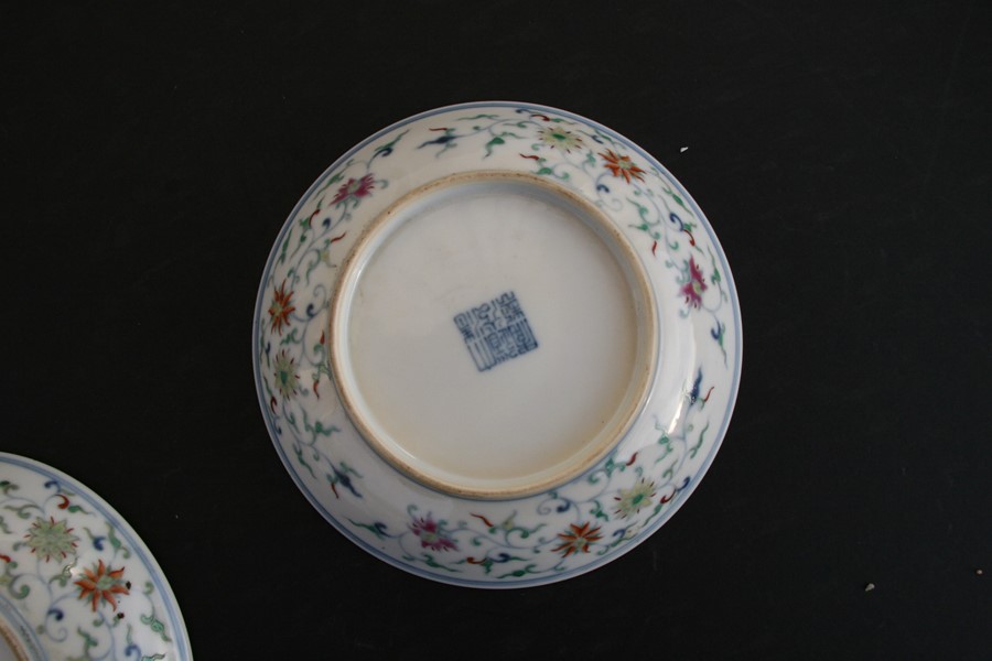 A pair of Chinese shallow dishes decorated with foliate scrolls, blue seal mark to the underside, - Image 3 of 13