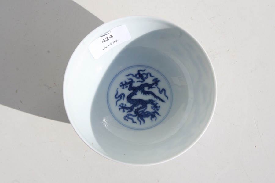 A 19th century Chinese blue & white bowl decorated with dragons amongst clouds, Qianlong seal mark - Image 8 of 11