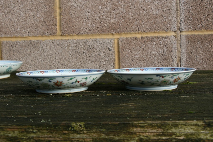 A pair of Chinese shallow dishes decorated with foliate scrolls, blue seal mark to the underside, - Image 10 of 13