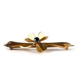 An Edwardian yellow metal shamrock leaf bar brooch.