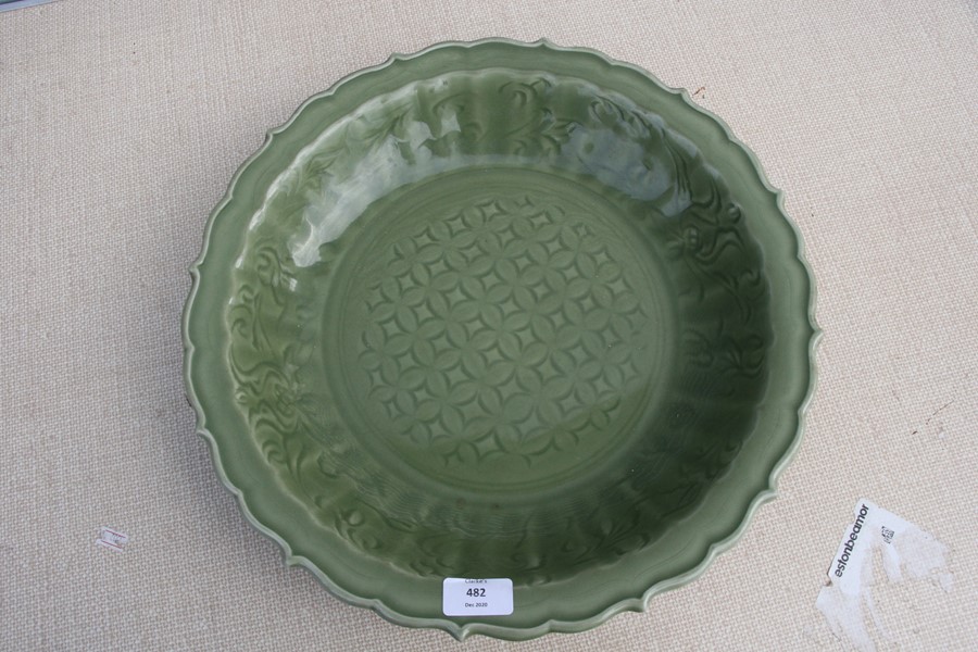 A large Chinese celadon glaze shallow bowl with incised decoration, 40cms (15.75ins) diameter. - Image 3 of 4