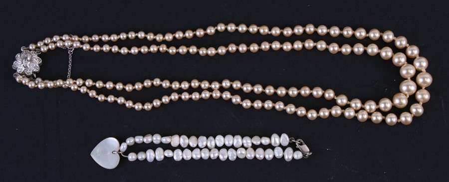 A pearl bracelet with silver clasp; together with a faux pearl necklace (2).