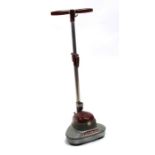 A vintage Electrolux floor polisher.