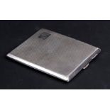 A silver cigarette case with engine turned decoration, initialled 'CEB', Birmingham 1927, weight