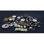 A quantity of costume jewellery to include lockets, rings, bracelets and brooches.