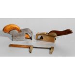 A Victorian brass and mahogany shaving plane; together with other woodworking tools.