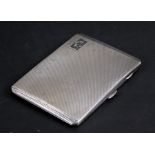 A silver cigarette case with engine turned decoration, Birmingham 1941, weight 146g, 11cms (4.