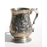 A George III silver half pint tankard with scroll handle and repousse decoration, marks rubbed,
