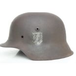 A WW2 German Third Reich M1942 helmet shell with single decal. Stamped to the inside: hkp 64 and
