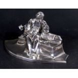 An early 20th century Art Nouveau silver plated inkstand by Kayserzinn in the form of a pensive