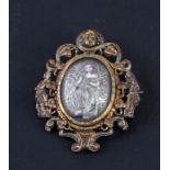 A 19th century gilt metal and enamel Renaissance Revival brooch with central figure holding a