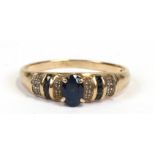 A 9ct gold diamond and sapphire ring, approx UK size 'Q'.