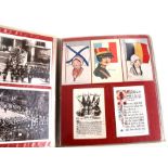 Two albums containing early 20th century post cards and postal history to include WWI silks,