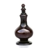 A cherry amber Bakelite style snuff bottle, 6cms (2.25ins) high.