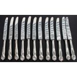 A set of twelve silver plated handled dinner knives with a matching set of twelve dessert knives.