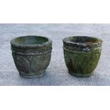 A pair of well weathered reconstituted stone garden planters, 28cms (10.25ins) high (2).
