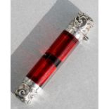 A Victorian silver double-ended and cranberry glass scent bottle, 9cms (3.5ins) long.