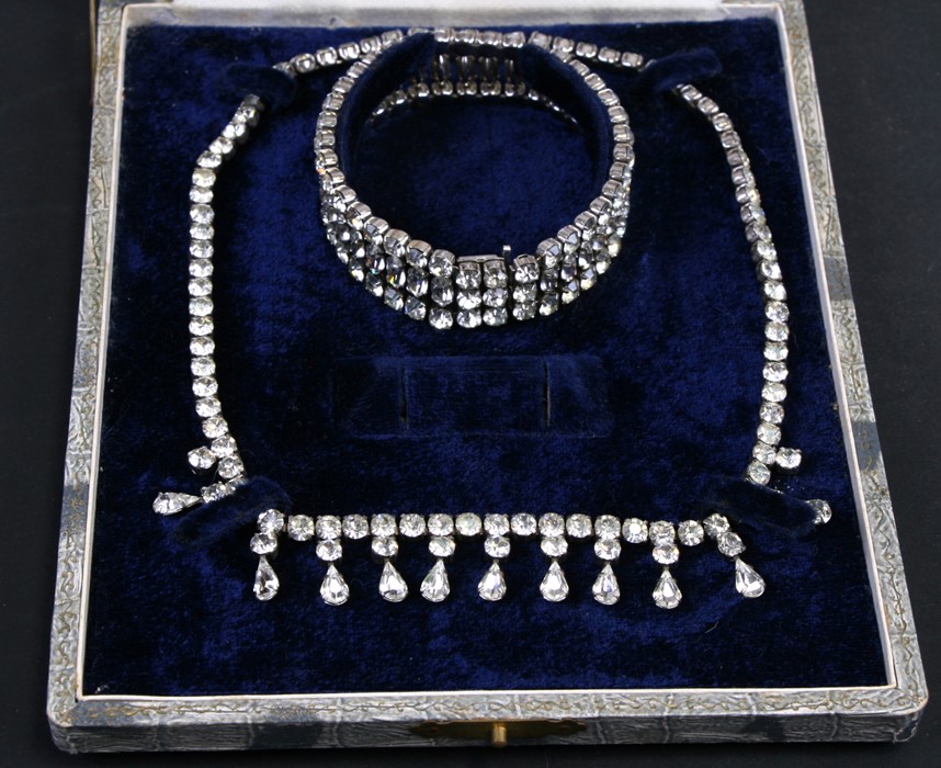 A silver paste closed back Riviere necklace and matching bracelet, boxed.