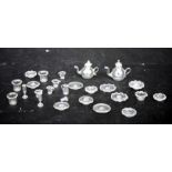 A 19th century glass doll's house tea set, wine glasses and other glassware.