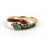 A 14ct gold diamond, ruby and emerald crossover ring, approx UK size 'M'.