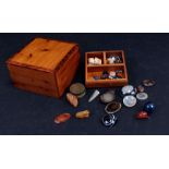 A quantity of loose cut and natural stones to include garnet and agate, in a yew wood box.