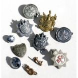 A quantity of military cap and other badges.