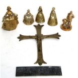 A group of brass hand bells in the form of crinoline ladies; together with a brass crucifix and