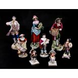 A group of continental porcelain figures to include Naples, the largest 15cms (6ins) high (8).