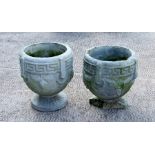A pair of concrete garden planters, 26cms (10ins) high (2).Condition Report The base broken on one