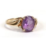 A 9ct gold diamond and amethyst ring, approx UK size 'O'.