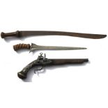 An Indonesian kris with carved wooden handle and steel blade, 57cms (22.5ins) long; together with an