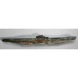 A bronze trench art submarine, 44cms (17.25ins) wide.