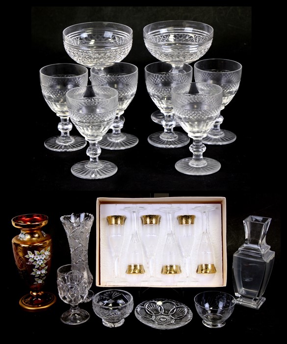 A pair of Waterford Crystal champagne glasses; together with a set of six French St Louis Crystal