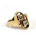 A 14ct gold and two-stone diamond cross-over ring, approx. UK size 'K', boxed. 5.1g