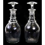 A pair of Georgian cut glass decanters, 29cms (11.4ins) high (2).Condition Reportboth stopper fit