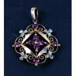 An Edwardian 9ct gold amethyst and seed pearl pendant, 4.5cms (1.75ins).