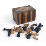 An antique straw work box containing a part chess set, 17cms 96.75ins) wide.