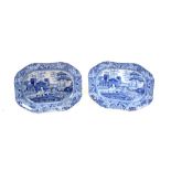 A pair of 19th century blue & white transfer printed pottery meat plates decorated with rural scenes